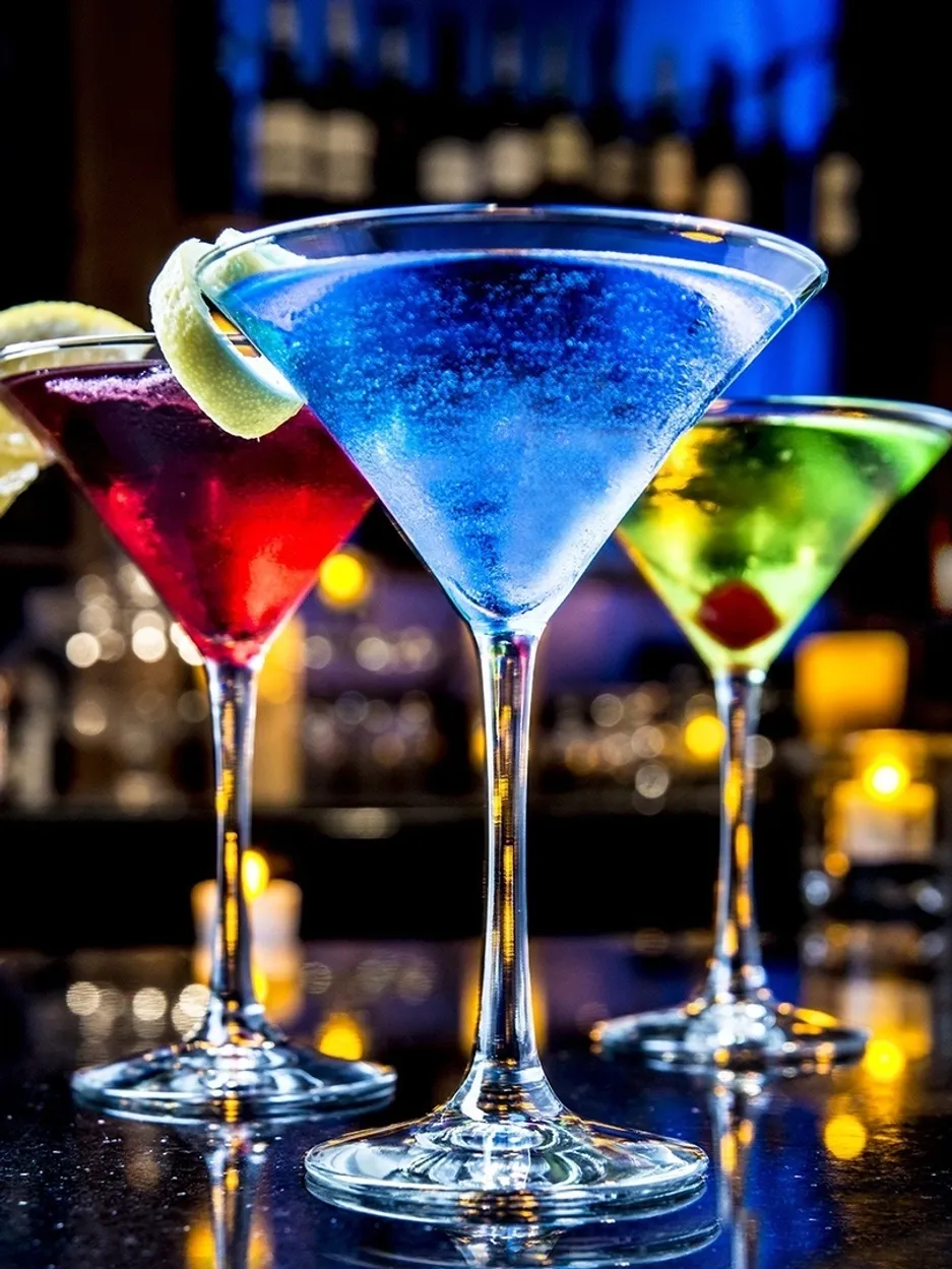 Vibrant martinis with lime garnish